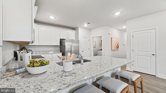 7 Florence Sarah Ln, Lexington City, VA 24450 - kitchen with freestanding refrigerator, a peninsula, white cabinets, washer / dryer, and light stone countertops
