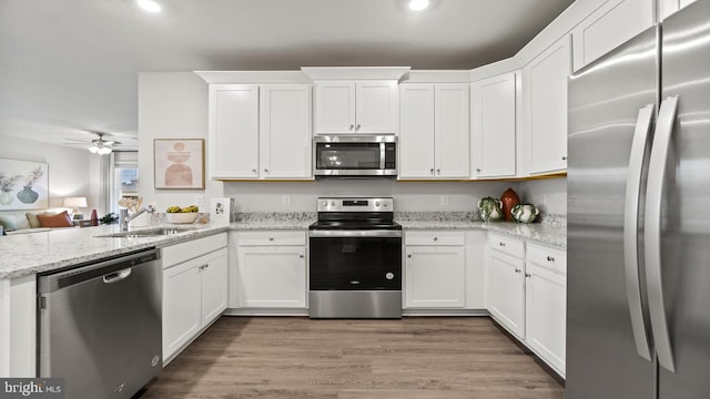 7 Florence Sarah Ln, Lexington City, VA 24450 - kitchen with stainless steel appliances, a sink, recessed lighting, white cabinetry, and a ceiling fan