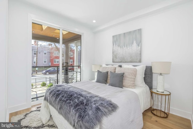 5403 5th St NW Unit 1, Washington, DC 20011 - bedroom featuring access to outside, baseboards, and wood finished floors