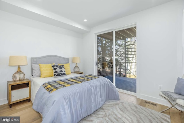5403 5th St NW Unit 1, Washington, DC 20011 - bedroom featuring access to outside, wood finished floors, baseboards, and recessed lighting