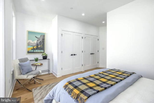 5403 5th St NW Unit 1, Washington, DC 20011 - bedroom with two closets, light wood-style floors, recessed lighting, and baseboards