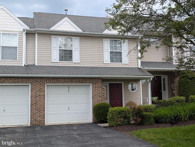 6502 Terrace Ct, Harrisburg, PA 17111 - view of property featuring driveway, a shingled roof, brick siding, and an attached garage