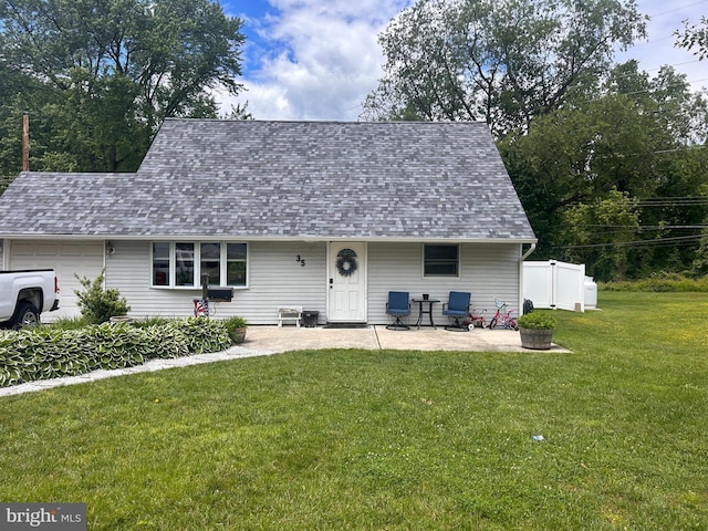 35 Long Loop Rd, Levittown, PA 19056 - view of front of property featuring a garage, roof with shingles, and a patio area