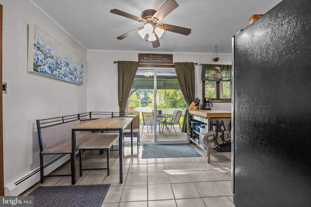 35 Long Loop Rd, Levittown, PA 19056 - tiled dining area featuring crown molding, a ceiling fan, and a baseboard radiator