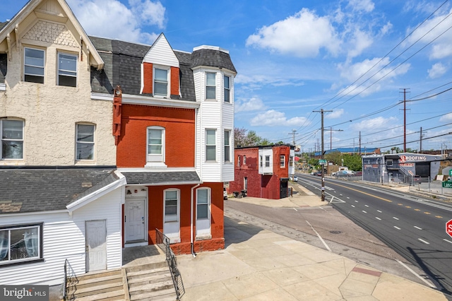 1718 N 55th St, Philadelphia, PA 19131 - multi unit property featuring roof with shingles, entry steps, and brick siding
