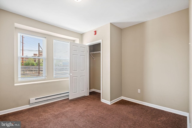 1718 N 55th St, Philadelphia, PA 19131 - unfurnished bedroom featuring a baseboard heating unit, dark colored carpet, a closet, and baseboards