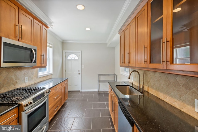 816 S Milton Ave, Baltimore, MD 21224 - kitchen with appliances with stainless steel finishes, a sink, recessed lighting, brown cabinets, and crown molding