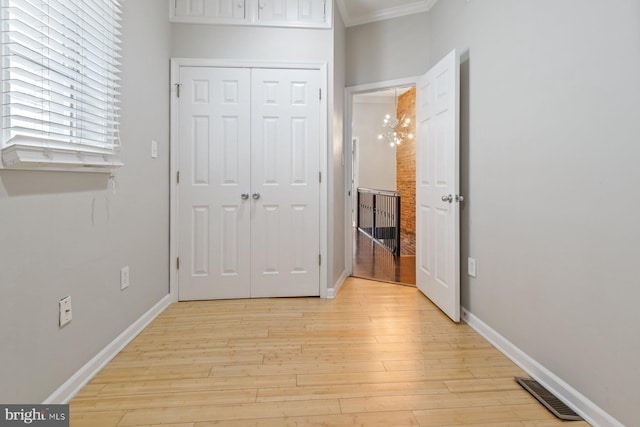 816 S Milton Ave, Baltimore, MD 21224 - hallway with crown molding, light wood-type flooring, and baseboards