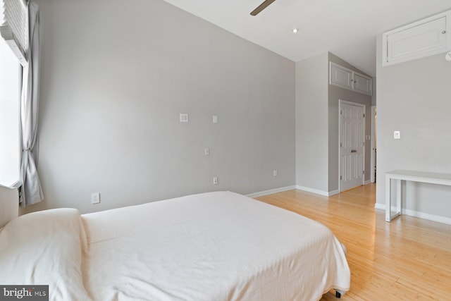 816 S Milton Ave, Baltimore, MD 21224 - bedroom with light wood-style floors, baseboards, ceiling fan, and lofted ceiling