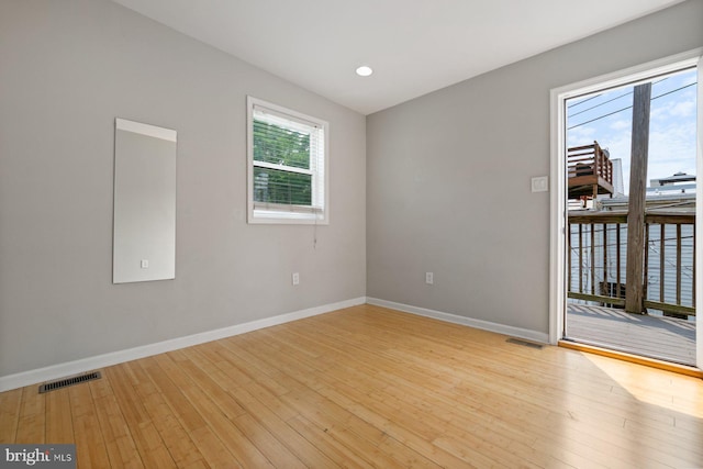 816 S Milton Ave, Baltimore, MD 21224 - unfurnished room with light wood finished floors, baseboards, and recessed lighting