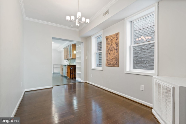 816 S Milton Ave, Baltimore, MD 21224 - unfurnished dining area with a chandelier, crown molding, dark wood-type flooring, and baseboards
