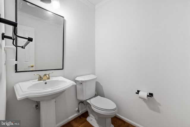 8321 Terra Grande Ave, Springfield, VA 22153 - half bath with ornamental molding, wood finished floors, baseboards, and toilet
