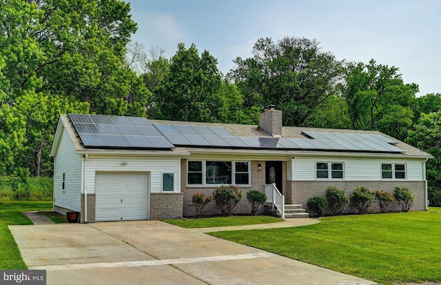 2411 Ruth Ave, Sparrows Point, MD 21219 - ranch-style house featuring an attached garage, a front yard, roof mounted solar panels, brick siding, and concrete driveway