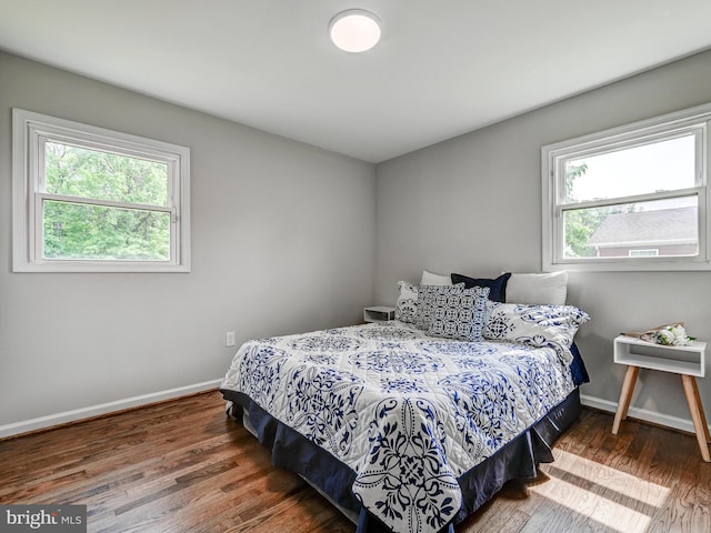 2411 Ruth Ave, Sparrows Point, MD 21219 - bedroom with multiple windows, wood finished floors, and baseboards