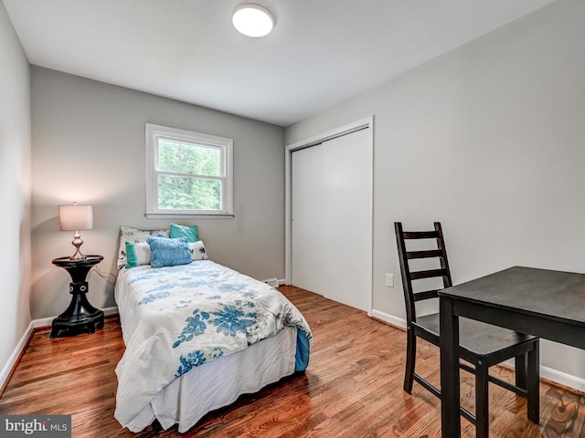 2411 Ruth Ave, Sparrows Point, MD 21219 - bedroom featuring a closet, wood finished floors, and baseboards
