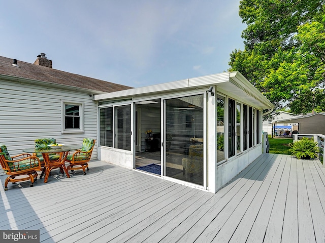 2411 Ruth Ave, Sparrows Point, MD 21219 - wooden terrace with a sunroom and outdoor dining area