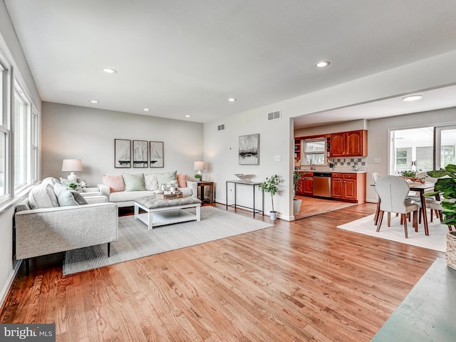 2411 Ruth Ave, Sparrows Point, MD 21219 - living room featuring light wood-style floors, recessed lighting, and baseboards