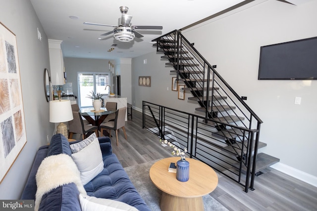 2127 Sigel St, Philadelphia, PA 19145 - living area featuring a ceiling fan, wood finished floors, baseboards, and stairway