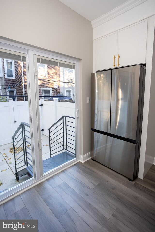 2127 Sigel St, Philadelphia, PA 19145 - doorway with wood finished floors, crown molding, and baseboards