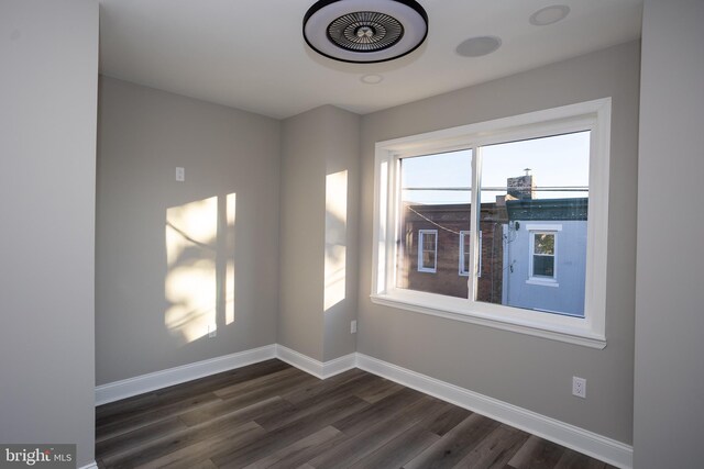 2127 Sigel St, Philadelphia, PA 19145 - spare room featuring dark wood-type flooring and baseboards