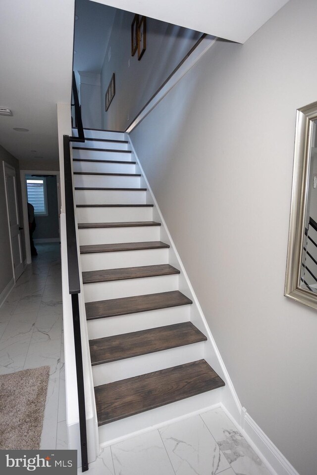 2127 Sigel St, Philadelphia, PA 19145 - stairs featuring marble finish floors and baseboards