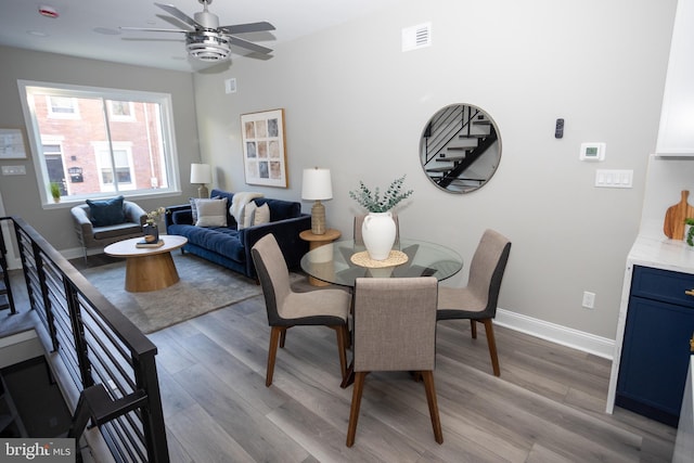 2127 Sigel St, Philadelphia, PA 19145 - dining space featuring light wood finished floors, a ceiling fan, and baseboards