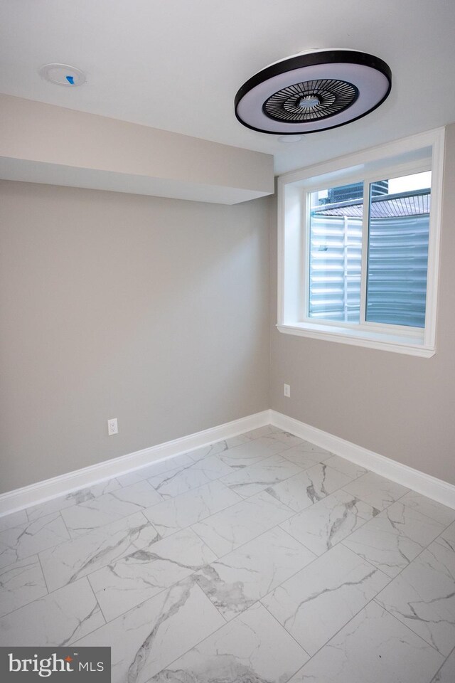 2127 Sigel St, Philadelphia, PA 19145 - spare room with baseboards and marble look tiles