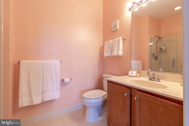 37685T Ulster Dr Unit 17, Rehoboth Beach, DE 19971 - bathroom featuring vanity, toilet, a stall shower, and tile patterned flooring