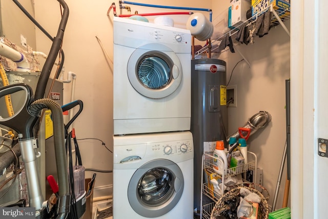 37685T Ulster Dr Unit 17, Rehoboth Beach, DE 19971 - laundry area with stacked washer / drying machine and water heater