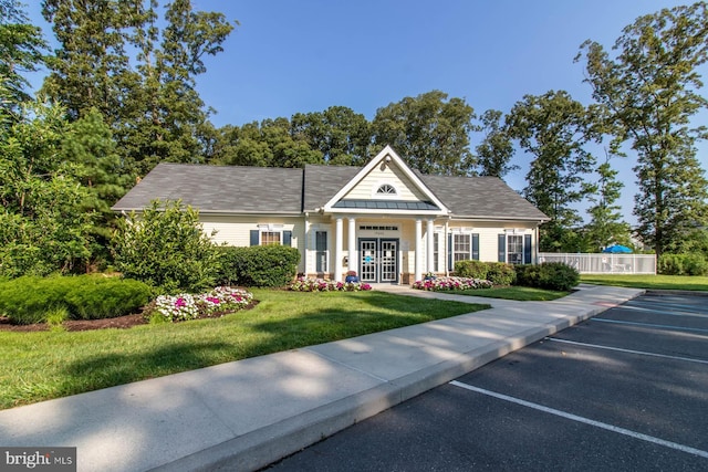 37685T Ulster Dr Unit 17, Rehoboth Beach, DE 19971 - neoclassical / greek revival house featuring uncovered parking, a front lawn, a standing seam roof, and metal roof