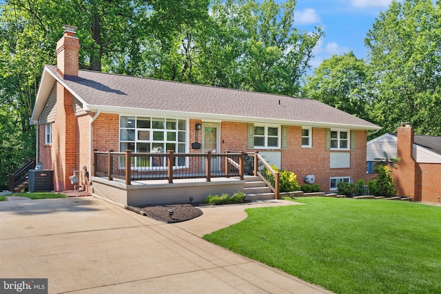 5634 Inverchapel Rd, Springfield, VA 22151 - ranch-style house featuring a chimney, central AC unit, a front yard, a shingled roof, and brick siding