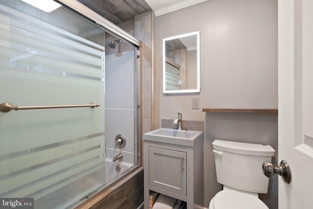 5634 Inverchapel Rd, Springfield, VA 22151 - bathroom featuring toilet, bath / shower combo with glass door, vanity, and crown molding