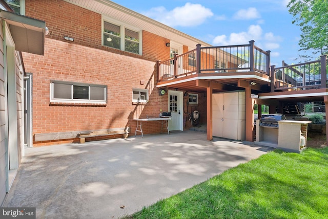 5634 Inverchapel Rd, Springfield, VA 22151 - back of property featuring a patio area, brick siding, and a wooden deck