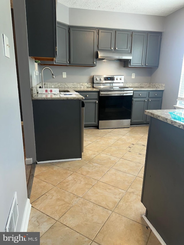 11429 Honeysuckle Ct Unit 3-3, Upper Marlboro, MD 20774 - kitchen with electric stove, extractor fan, gray cabinets, a sink, and a textured ceiling