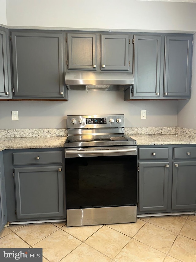 11429 Honeysuckle Ct Unit 3-3, Upper Marlboro, MD 20774 - kitchen with electric range, under cabinet range hood, light tile patterned floors, and gray cabinets