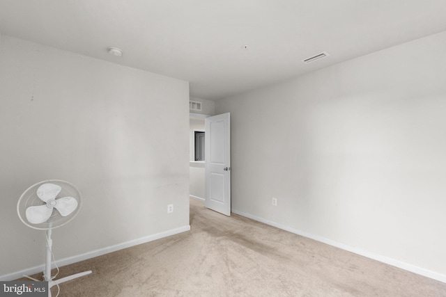 213 Pickett St, Taneytown, MD 21787 - spare room with a smoke detector, light colored carpet, and baseboards