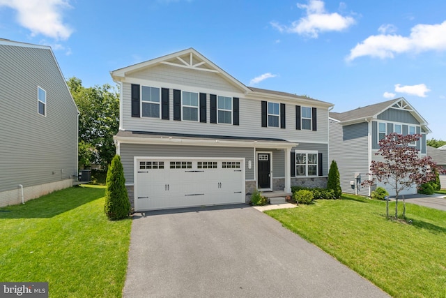 213 Pickett St, Taneytown, MD 21787 - craftsman-style house featuring central AC, asphalt driveway, stone siding, an attached garage, and a front yard