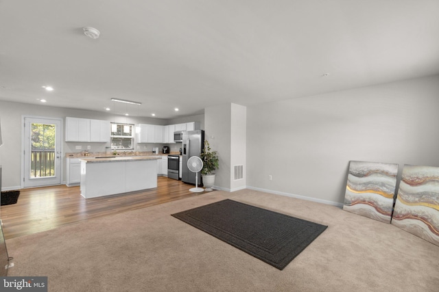 213 Pickett St, Taneytown, MD 21787 - living room with recessed lighting, light colored carpet, baseboards, and light wood finished floors