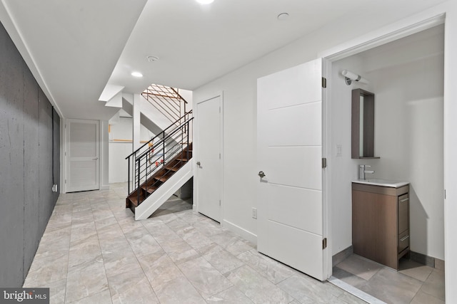 2313 Tulip St, Philadelphia, PA 19125 - below grade area featuring stairs, recessed lighting, and a sink