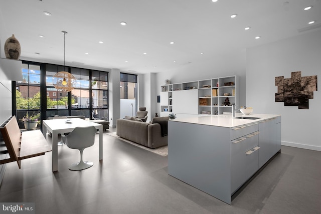108 Arch St Unit 304, Philadelphia, PA 19106 - kitchen featuring modern cabinets, recessed lighting, a center island with sink, a sink, and light countertops