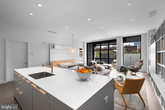 108 Arch St Unit 304, Philadelphia, PA 19106 - kitchen featuring a sink, an island with sink, recessed lighting, open floor plan, and light countertops