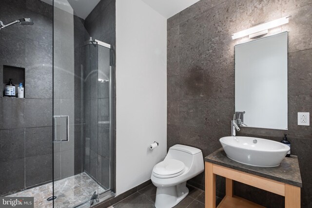108 Arch St Unit 304, Philadelphia, PA 19106 - full bathroom with tile walls, a shower stall, toilet, tile patterned flooring, and vanity
