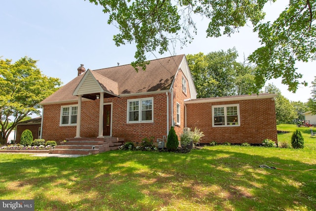 312 E 7th Ave, Trappe, PA 19426 - view of front of home with brick siding, a chimney, and a front yard