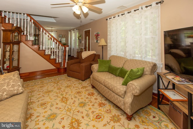 312 E 7th Ave, Trappe, PA 19426 - living room featuring healthy amount of natural light, a ceiling fan, stairway, and wood finished floors