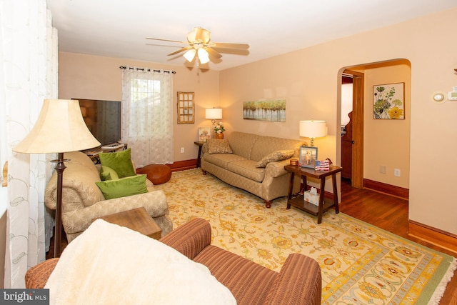 312 E 7th Ave, Trappe, PA 19426 - living area with wood finished floors, baseboards, ceiling fan, and arched walkways