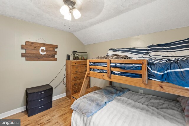 171 Sinking Spring Ln, Gore, VA 22637 - bedroom with wood finished floors, vaulted ceiling, a textured ceiling, and a ceiling fan