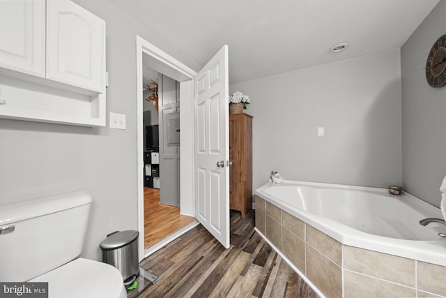 171 Sinking Spring Ln, Gore, VA 22637 - bathroom featuring a garden tub and wood finished floors