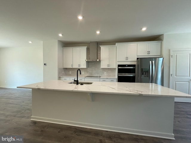 13206 Nixon Ln, Woodbridge, VA 22193 - kitchen with black appliances, wall chimney exhaust hood, a sink, a large island with sink, and white cabinets