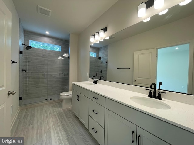 13206 Nixon Ln, Woodbridge, VA 22193 - full bath featuring double vanity, a shower stall, and toilet