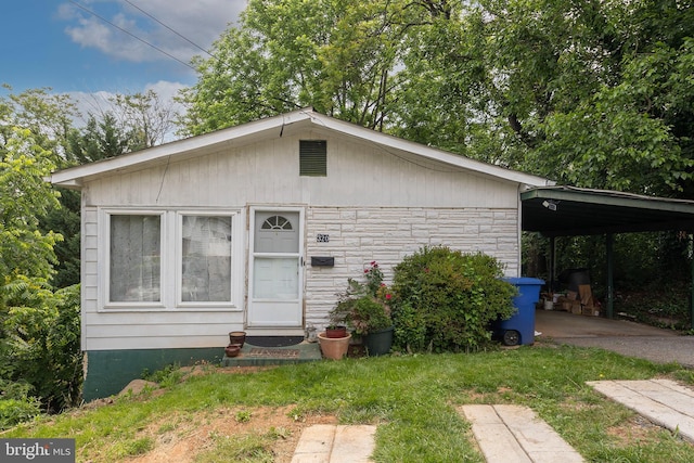 320 Lee St, Front Royal, VA 22630 - bungalow with stone siding, a carport, driveway, and a front lawn